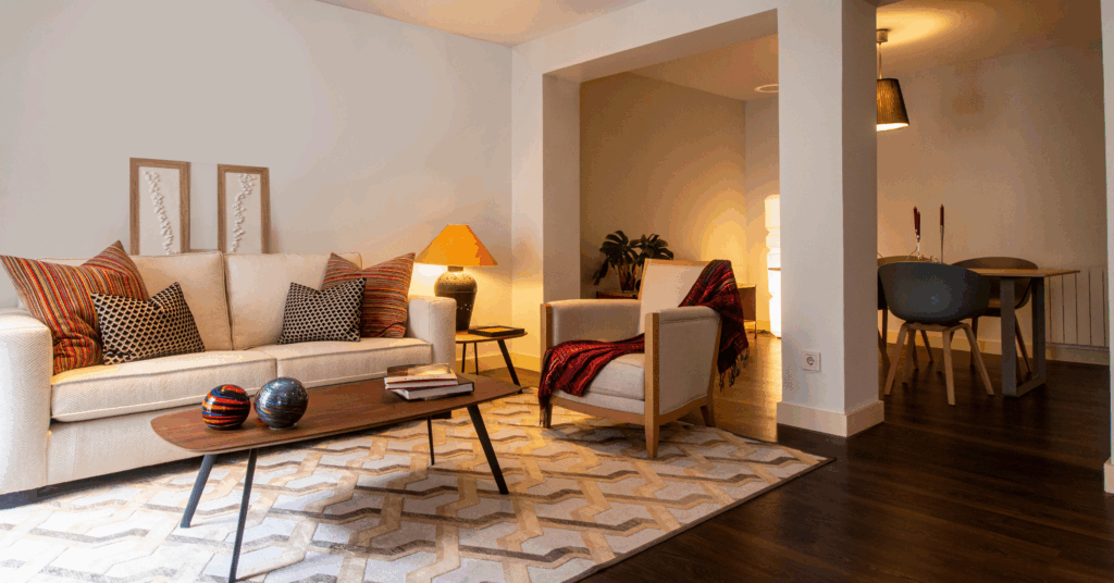 cozy living room with modern furniture and a patterned rug.